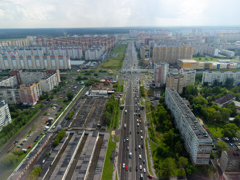 Drone shot captured with DJI Mini 2 overlooking Montazhnikov Street (Ulitsa Montazhnikov) and its intersection with Shirotnaya Street in Tyumen, Russia. The photo shows a typical urban residential and