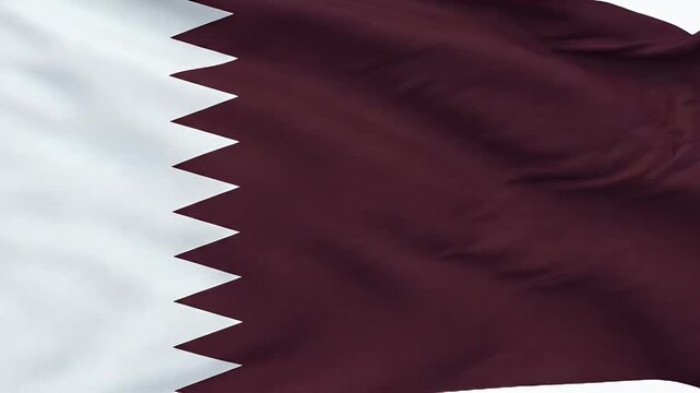 The video shows the national flag of Qatar, featuring a maroon field with a broad white serrated band with nine points along the hoist side.