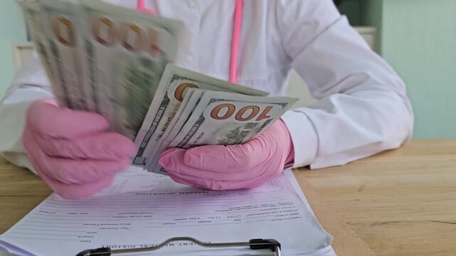Nurse counts cash while reviewing medical payment documents at clinic in busy city setting