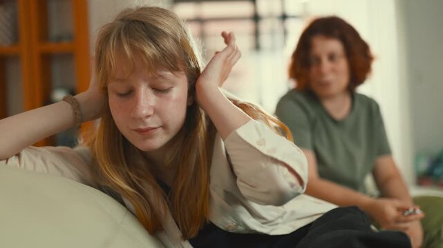 Frustrated teenage girl arguing with her mother