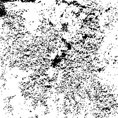 Fototapeta premium Abstract speckled black-and-white texture with irregular blotches and scattered dots. High-contrast stippled background ideal for artistic, graphic, and design projects