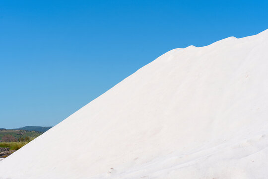 White Salt Mountain at Kalloni Salt Pans in Lesbos Greece Under Blue Sky