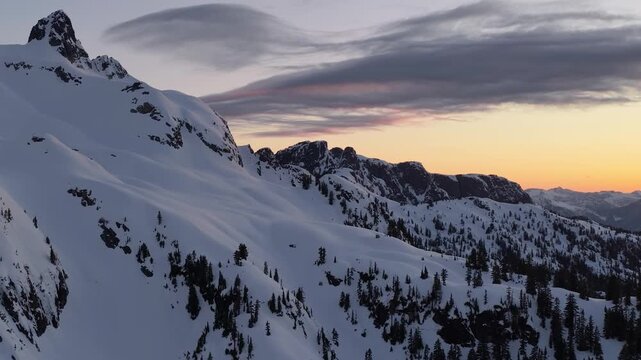 Winter Sunset Over Snowy Mountains In British Columbia, Canada