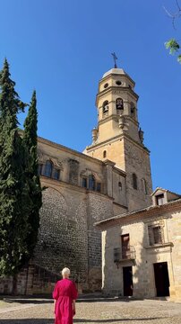 Female traveler exploring historic architecture in Baeza Spain
