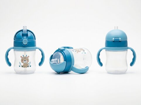 three blue toddler sippy cups with straw handles baby feeding