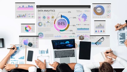 Naklejka premium Dynamic Data Analytics Workspace with Charts Graphs and Laptop Displaying Analytical Metrics on Table for Professional Business Use Sigmoid