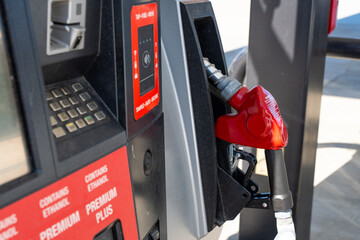Fototapeta premium Horizontal photo of a gas pump at a station, illustrating rising fuel prices and the ongoing fuel crisis