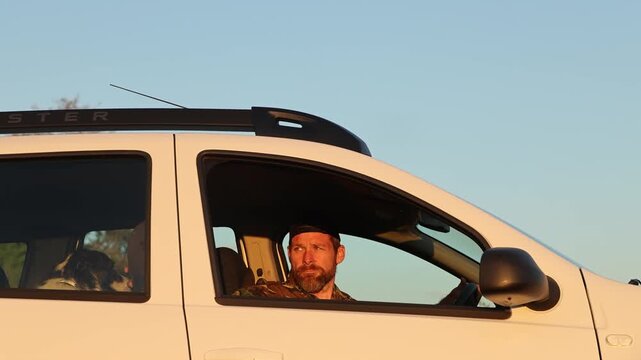 man loooking back and going with hiis car