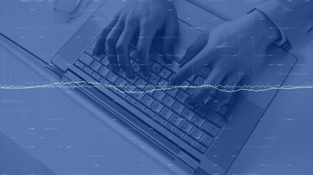 Man typing on laptop keyboard, keystrokes causing waveform peaks while syncing audio for editing