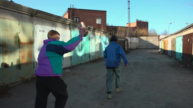 Chase In Urban Alleyway. Fastpaced Chase Involving Man Throwing Can At Fleeing Individual In Urban Alleyway. Media