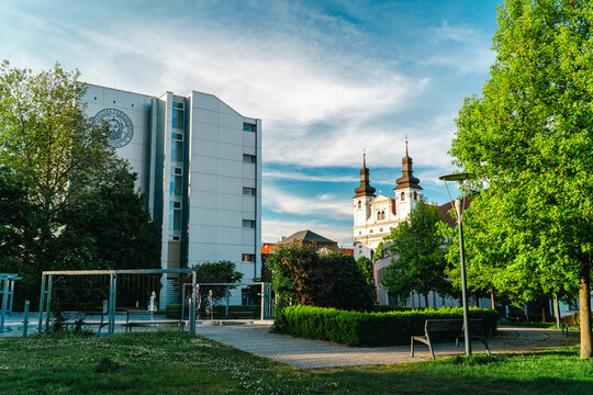 Green city park with cathedral towers in Trnava Slovakia