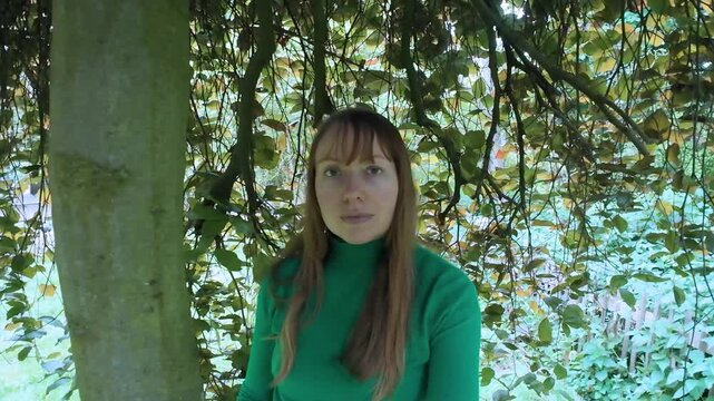 Woman behind a tree wellness spirituality concept