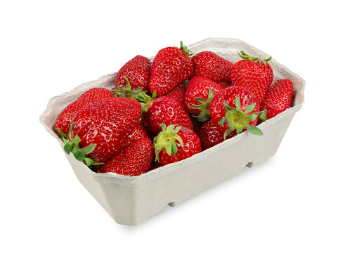 Delicious red German strawberries in sustainable cardboard packaging. Fresh from the market. Box isolated on white background.