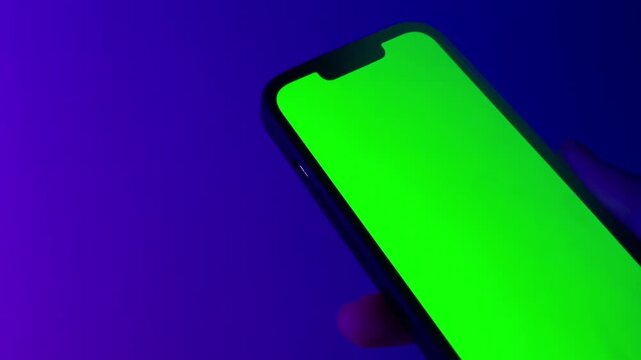 hand holding phone mockup green screen