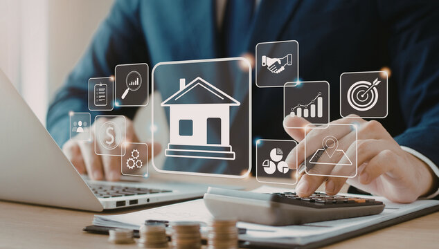 Businessman analyzing financial data on laptop with calculator and house icons.
