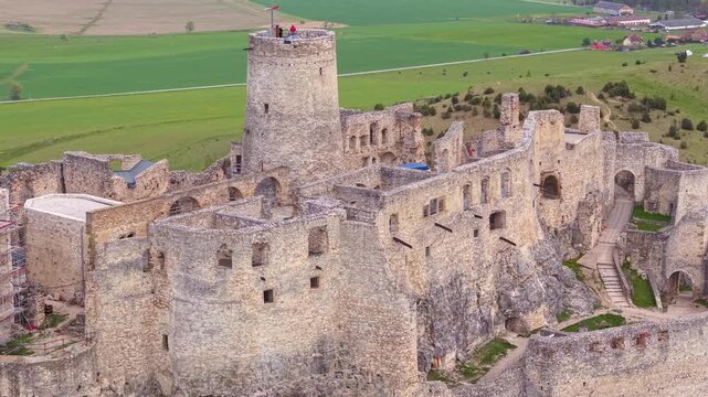 Breathtaking aerial footage of the historic Spis Castle ruins in Slovakia. Majestic stone fortress and its towers on a hilltop