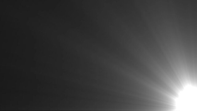 Top corner white light rays and lens flare flashes leak animation on black background, symbolizing clarity, brilliance, and pure illumination, High quality stock footage of sun rays light effects,