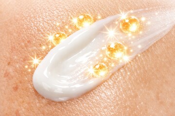 Fototapeta premium Cream applied on skin with glowing effects showing beauty and skincare routine