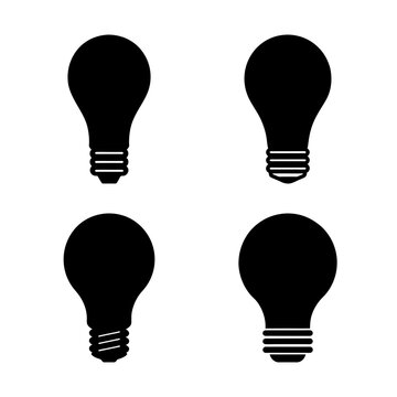 Four black light bulb icons in grid - Simple black light bulb icons arranged neatly in a 2x2 grid for design and illustration use.
