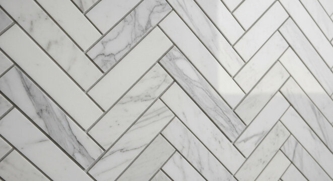 Close-up abstract geometric herringbone pattern of white and marble tiles with grey grout, showcasing a sophisticated interior design element for modern luxury.