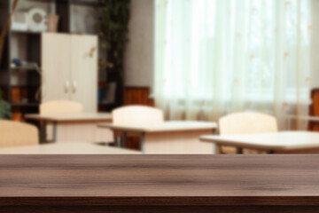 Fototapeta premium Classroom with empty desks and wooden surface, selective focus. Space for design