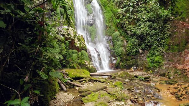 Waterfall at Junin, Imbabura province in Western Ecuador, within a critical mining concession with high biodiversity. drone shot