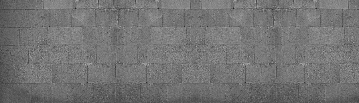 Front view of a wall made of gray slabs. background of a new and modern wall or building exterior grey slabs Marble brick pattern floor abstract natural marble black gray wall Top view and front view