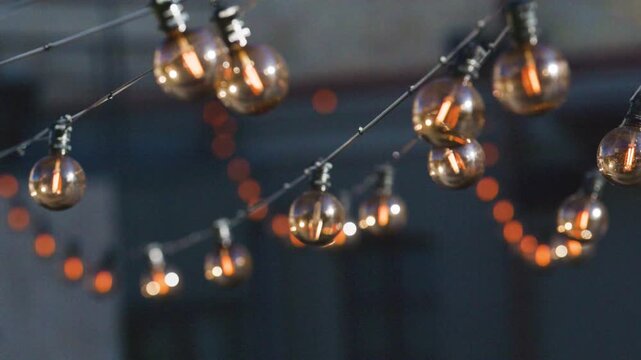 Glowing outdoor string lights creating cozy evening atmosphere
