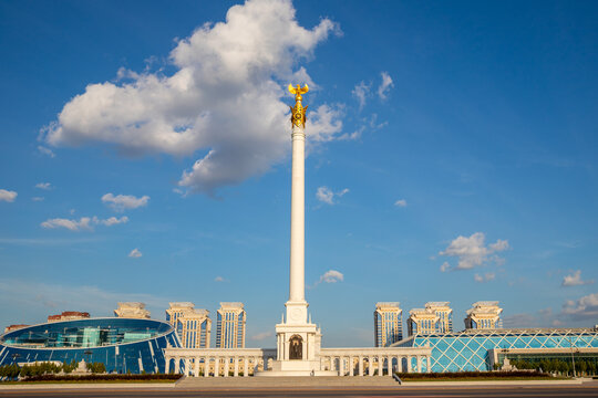 Kazakh Eli monument on Independence Square in Astana. Tall white pillar with golden mythical bird on top. National landmark and architectural symbol of Kazakhstan city travel sight. 08.06.25