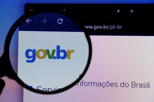 Salvador, Brazil - May 8, 2026: Official Gov.br logo on its website seen through a magnifying glass. Brazilian Gov Br website. 