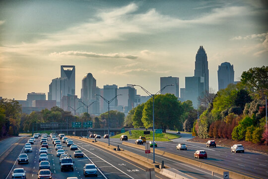  Charlotte North Carolina Skyline with Uptown Skyscrapers Park Green Space and Curving Highway Leading into Downtown City View