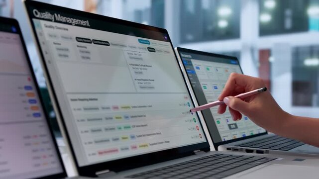 Quality Manager Reviewing Corrective Actions On Laptop