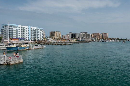 Clearwater Beach Florida Waterfront with Marina Boats and Coastal Residential Buildings Along Calm Gulf Waters