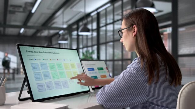 Woman Doing Product Innovation Brainstorming Session On Laptop Computer