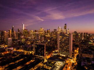  Aerial View of the Chicago Skyline at Sunset Over Lake Michigan with Dramatic Golden Hour Reflections and Downtown Skyscrapers © Joshua 
