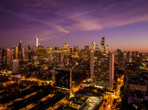  Aerial View of the Chicago Skyline at Sunset Over Lake Michigan with Dramatic Golden Hour Reflections and Downtown Skyscrapers