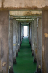 Fototapeta premium Under a concrete pier. Long exposure photography