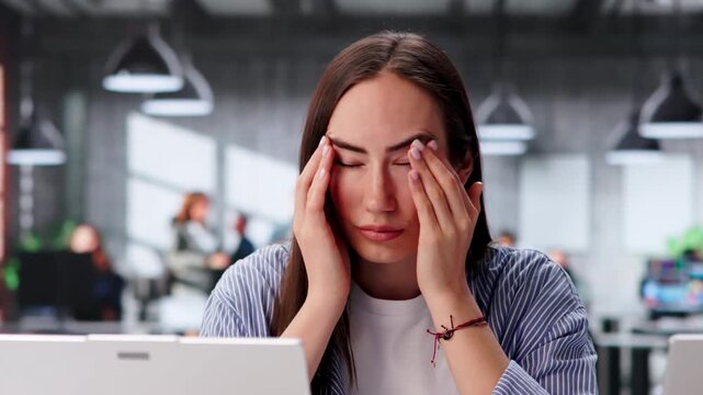 Office Manager Having Eye Strain From Prolonged Use