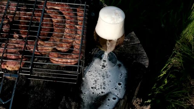 Grilled sausages and steaks Snacks with meat, sausage, French fries, crackling and beer. High quality 4k footage