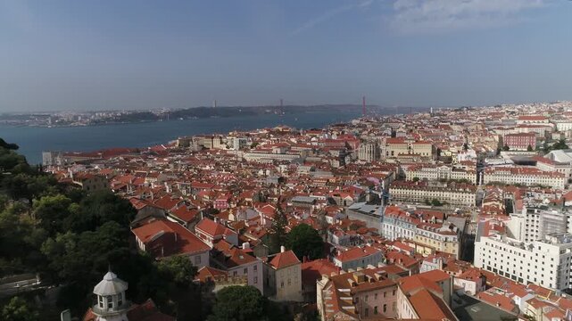 ly Above Historic City Buildings of Lisbon, Portugal