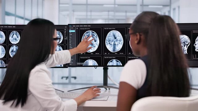 Radiologist And Neuro Doctor Monitoring MRI Brain Scan