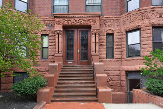 Front steps of old brownstone apartment building