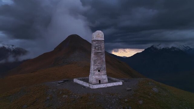 Aerial view of Ama Yangri monument on a mountain ridge at dusk