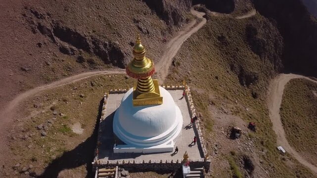Aerial orbit of Ama Yangri stupa on a remote Himalayan mountain peak