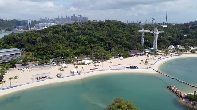Aerial view of Siloso Beach and Sentosa Island skyline on a sunny day, Singapore