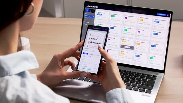 Young Woman Using Document Management Software On Laptop
