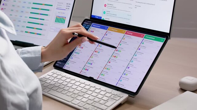 Agile Project Manager Reviews Kanban Board Tasks
