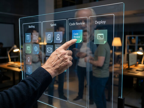 Man's finger interacts with a digital interface displaying a workflow with tasks like building, code review, and deployment