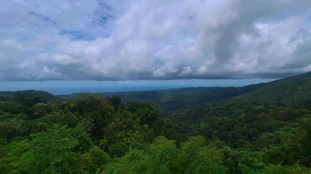 Wide mountain and ocean view from El Yunque National Rainforest in Puerto Rico