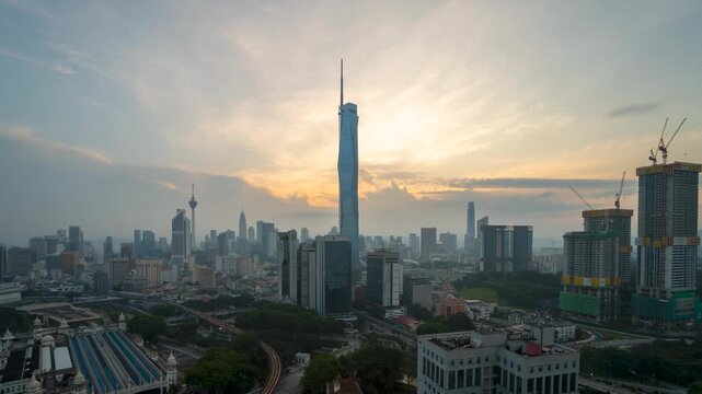 Aerial view time lapse 4k video of Kuala Lumpur city center view during dawn overlooking the city skyline in Federal Territory, Malaysia. 